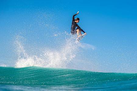 Jordy Smith performs and aerial while surfing at Duranbah Beach on the Gold Coast of Australia.