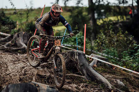 A female rider covered in mud rides at the UCI Mountain Bike Downhill World Championships in Leogang, Austria on October 11, 2020.