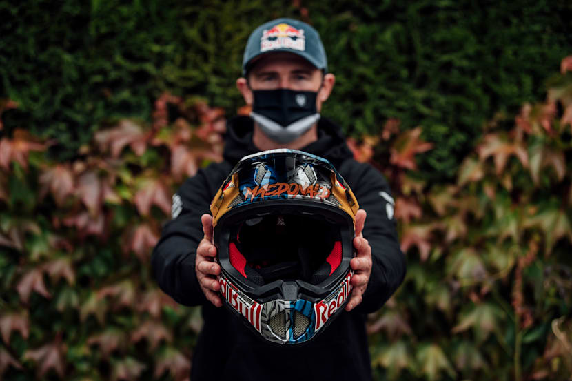 Brook Macdonald holds his custom helmet at Leogang MTB World Champs 2020.