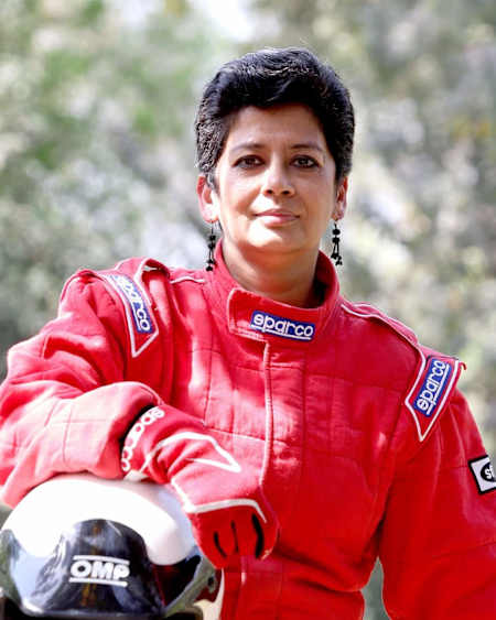 Rally driver Dr Bani Yadav seen in firesuit racing overalls with her helmet
