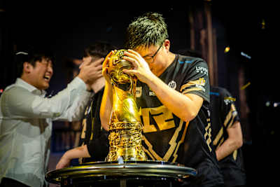 Uzi gives the MSI trophy a little cuddle.