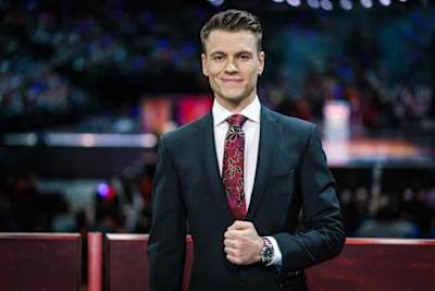 A photo of esports commentator Quickshot preparing for a broadcast.