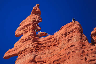 Two climbers scale part of Fischer Towers in Moab.