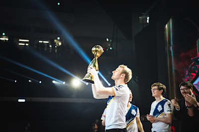 A photo of Marcin 'Jankos' Jankowski lifting the Mid-Season Invitational 2019 trophy