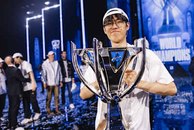 Oner holding a trophy.