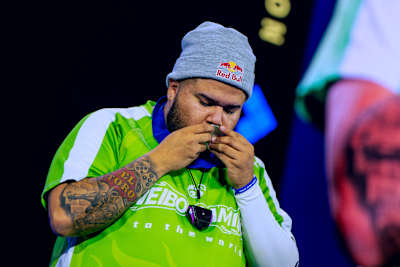 MenaRD kisses his first-place medal after his Street Fighter 6 Grand Final win at EVO Championship Series in Las Vegas, Nevada, USA on August 3, 2025.