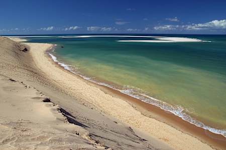 Sandy beach and turquoise seas.