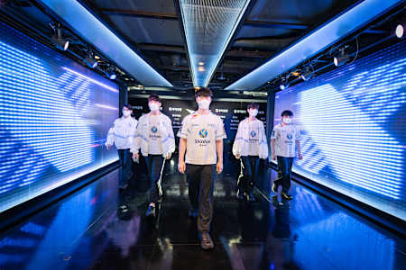 DRX walk through a branded hallway at the LoL Park in Seoul, South Korea
