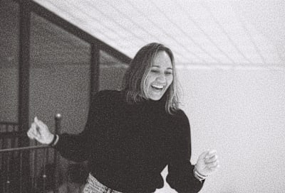 A black and white still image of surfer Carissa Moore from the surf film RISS.