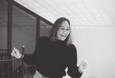 A black and white still image of surfer Carissa Moore from the surf film RISS.