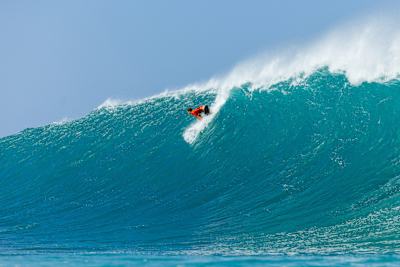 Jack Robinson takes off on a big wave at Backdoor Pipeline during the Lexus Pipe Pro