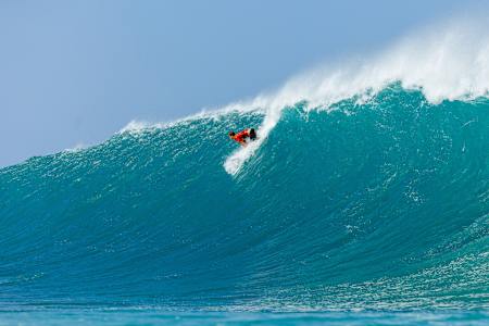 Jack Robinson takes off on a big wave at Backdoor Pipeline during the Lexus Pipe Pro