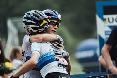 Pauline Ferrand-Prévot and Loana Lecomte as seen at the end of the 2022 Val di Sole UCI Women's XCO MTB World Cup race.
