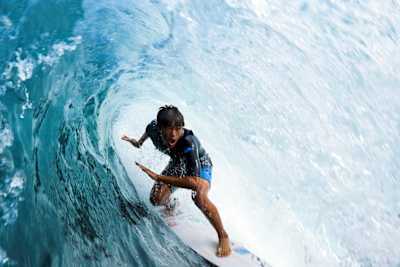 Surfer Rio Waida rides the barrel in East Java.