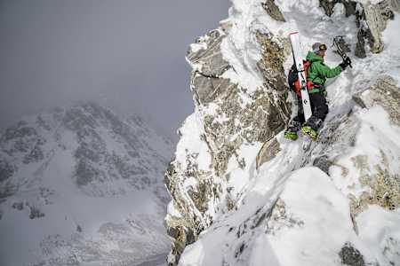 Jimmy Chin using an ice axe while ski mountaineering in the Tetons.