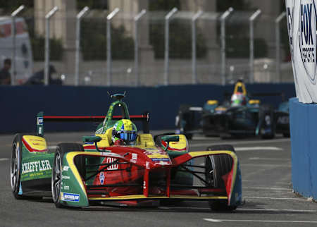 A Formula E racing car in action.
