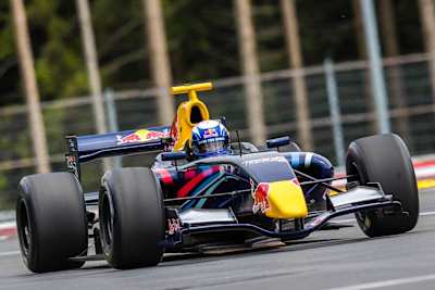 An image of skier Lindsey Vonn driving a Formula Renault 3.5 at the Red Bull Ring in Austria.