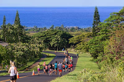 Run the Kauai Marathon with green tropical rain forests, volcanic peaks and white beaches as your backdrop