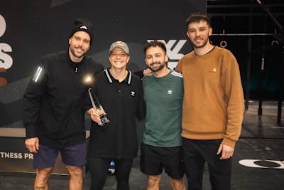 Laura Horváth poses with her coaching team, which includes her two brothers.