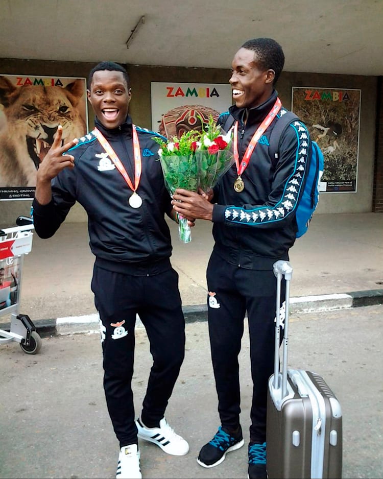The pair at the airport in Zambia after victory at the COSAFA U-20 Cup