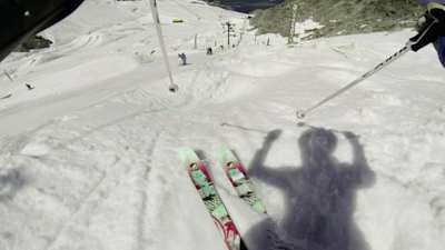 POV view of skiing moguls.