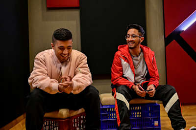 Encore ABJ and Calm share a joke in a recording studio.