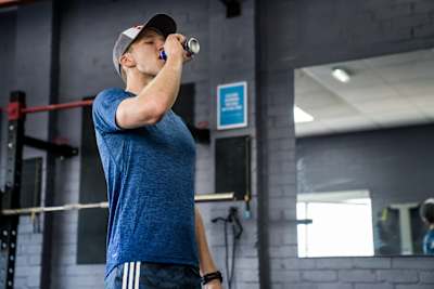 Ultrarunner Tom Evans drinks Red Bull while training regime at a Surrey-based gym.