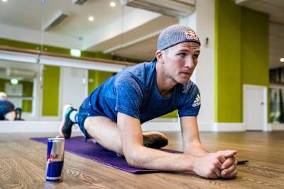Tom Evans performs a stretch exercise at an indoor gym in Surrey, United Kingdom on October 11, 2018.