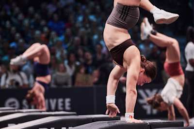 Laura Horváth walks on her hands at the World Fitness Project Final in Copenhagen, Denmark on December 21, 2025.
