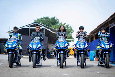 Racers pose with their bikes at Kari Motor Speedway in Coimbatore