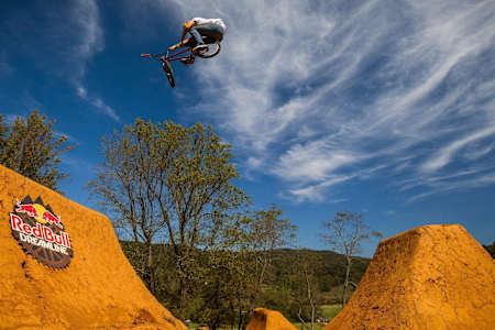 Polish rider Dawid Godziek pulls a toboggan over a jump set during practice at Red bull Dreamline in Asheville, North Carolina
