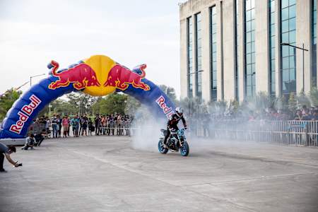 Aaron Colton performs a rolling burnout on his motorcycle during a showcase.