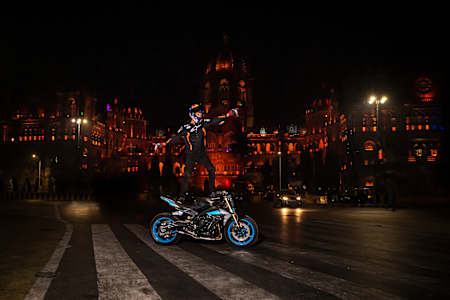 Aaron Colton surfs on his motorcycle as part of a performance showcase.