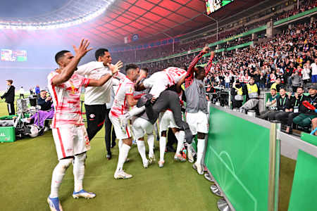RB Leipzig players celebrate beating SC Freiburg in the DFB Cup final. 