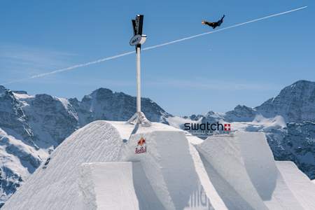 Snowboarder Valentino Guseli in mid-air during the Swatch NINES event at Schilthorn, Switzerland on April 12, 2024.