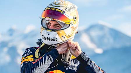 Formula 1 World Champion Max Verstappen and his helmet for the 2022 F1 World Championship season.