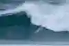 Justine Dupont surfing at the Nazare Big Wave Challenge