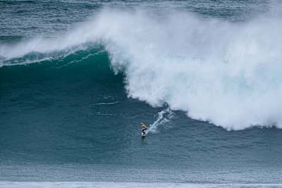 Justine Dupont surfing at the Nazare Big Wave Challenge