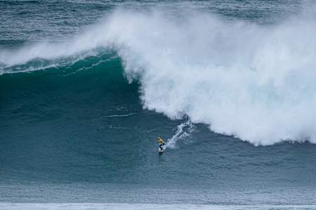 Justine Dupont surfing at the Nazare Big Wave Challenge