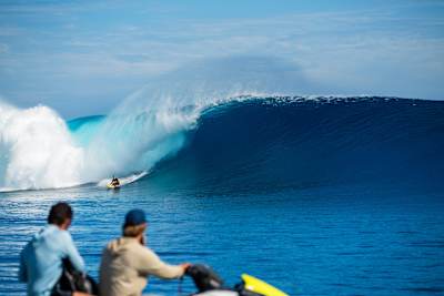 Julian Wilson takes off on an enormous wave at Cloudbreak in Fiji. 