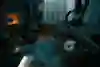A camera operator films Jesper Tjäder lying on a sofa in a living room with shelves of CDs and albums in the background.