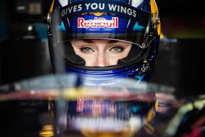 Lindsey Vonn behind the wheel of a Formula One car.