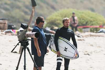 Kolohe Andino on the beach with father Dino Andino.