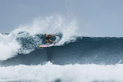 Erin Brooks surfing at Cloudbreak