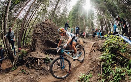 Pauline Ferrand-Prevot races at the 2022 edition of the XCO men's race at the Lenzerheide World Cup.