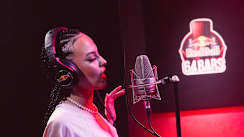 EVA sings at the mic for Red Bull 64 Bars.