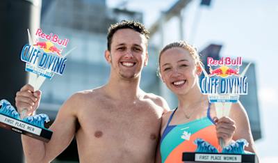 Aidan Heslop of the UK and Molly Carlson of Canada with their winners trophies during the first stop of the Red Bull Cliff Diving World Series in Boston, USA on June 4, 2022.
