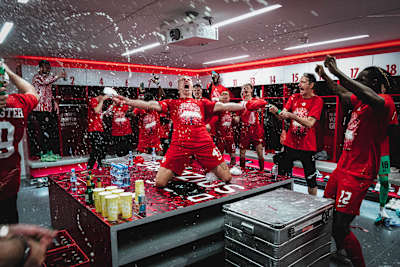 An image of Red Bull Salzburg footballer Rasmus Kristensen celebrating in the dressing room. 