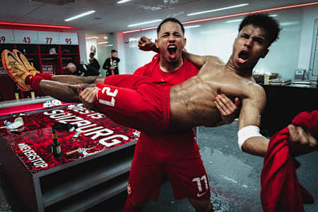 An image of Red Bull Salzburg players Noah Okafor and Karim Adeyemi celebrating in the changing room.