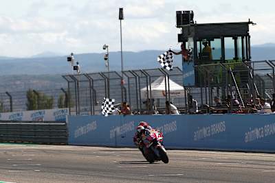 Enea Bastianini beats Francesco Bagnaia as the chequered flag is waved at the Aragon Grand Prix.
